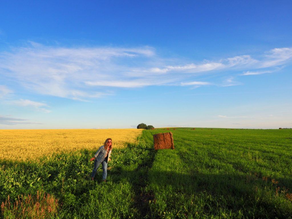 Brenna in canola fields in Swan Valley Manitoba